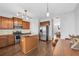 Well-lit kitchen with wood cabinets, stainless appliances, a center island, and an eat-in area at 3014 Liberty Nw Way, Atlanta, GA 30318