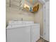 Functional laundry room with a side-by-side washer and dryer at 3014 Liberty Nw Way, Atlanta, GA 30318
