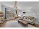 Bright living room featuring hardwood floors, stylish furnishings, and modern lighting at 3014 Liberty Nw Way, Atlanta, GA 30318