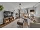Cozy living room with modern furnishings, rug, and a view of the neighborhood at 3014 Liberty Nw Way, Atlanta, GA 30318