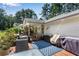 Back deck with hot tub, outdoor seating, and grilling area with wooded views at 435 Old Holly Rd, Milton, GA 30075