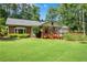 Expansive, well-manicured backyard with a charming deck, perfect for outdoor gatherings and relaxation at 435 Old Holly Rd, Milton, GA 30075
