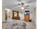 Bedroom featuring carpeted floors, neutral walls, ceiling fan and view to the en-suite bathroom at 435 Old Holly Rd, Milton, GA 30075