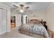 Bedroom with a ceiling fan, carpeted floors, neutral walls and views to the living room at 435 Old Holly Rd, Milton, GA 30075