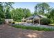 Spacious carport with ample parking and storage space, blending functionality with classic architectural design at 435 Old Holly Rd, Milton, GA 30075