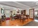Open dining room featuring hardwood floors, beamed ceilings, and natural light at 435 Old Holly Rd, Milton, GA 30075