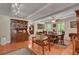 Elegant dining room featuring hardwood floors, a china cabinet, and ample seating at 435 Old Holly Rd, Milton, GA 30075