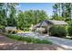 Scenic property with a spacious driveway, shed, and lush landscaping, offering privacy and tranquility at 435 Old Holly Rd, Milton, GA 30075