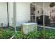 Image shows Generac whole house generator with home siding and screened-in porch in background at 435 Old Holly Rd, Milton, GA 30075