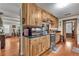 Bright kitchen featuring wooden cabinetry, hardwood floors, and stainless steel appliances at 435 Old Holly Rd, Milton, GA 30075