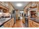 Modern kitchen with stainless steel appliances, wood cabinets, and granite countertops at 435 Old Holly Rd, Milton, GA 30075