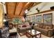 Spacious living room featuring wood-paneled walls, vaulted ceiling, and comfortable seating at 435 Old Holly Rd, Milton, GA 30075