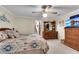 Spacious main bedroom featuring a ceiling fan, carpeted floors, and wood furniture at 435 Old Holly Rd, Milton, GA 30075