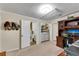 Office area with built-in desk, adjacent laundry and water closet at 435 Old Holly Rd, Milton, GA 30075