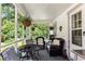 Inviting screened-in porch with comfortable seating and lush greenery views at 435 Old Holly Rd, Milton, GA 30075