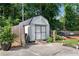 Durable outdoor shed with double doors and a ramp, perfect for storing your tools and equipment at 435 Old Holly Rd, Milton, GA 30075