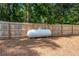 Large propane tank in the yard, safely secured and ready to supply your home's energy needs at 435 Old Holly Rd, Milton, GA 30075