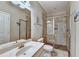Modern bathroom featuring a tiled shower with glass door and a vanity at 711 Topsail Ln, Alpharetta, GA 30005