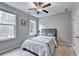 Cozy bedroom with natural light from two windows at 711 Topsail Ln, Alpharetta, GA 30005