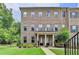 Charming brick townhome with well-maintained landscaping and inviting entrance at 711 Topsail Ln, Alpharetta, GA 30005