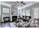 Comfortable living room with a fireplace and leather sofas at 711 Topsail Ln, Alpharetta, GA 30005