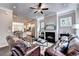 Open-concept living room with a fireplace, connecting to the kitchen at 711 Topsail Ln, Alpharetta, GA 30005