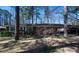 Charming single story home with mature landscaping, carport and red brick exterior at 1288 Skyview Sw Cir, Mableton, GA 30126