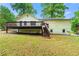 Spacious backyard featuring deck and stairs to the yard at 4110 Oak Ferry Ne Dr, Kennesaw, GA 30144