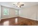 Large bedroom featuring hardwood floors and ample natural light at 4110 Oak Ferry Ne Dr, Kennesaw, GA 30144
