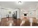 Open-concept living area with an eat-in kitchen and a fireplace at 4110 Oak Ferry Ne Dr, Kennesaw, GA 30144