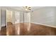 Large bedroom with hardwood floors and ensuite bathroom at 4110 Oak Ferry Ne Dr, Kennesaw, GA 30144