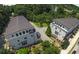 Aerial view of townhomes surrounded by lush trees in a desirable community location at 5836 Sandy Springs Cir, Atlanta, GA 30328
