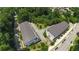 Aerial view of townhomes surrounded by lush trees in a desirable community location at 5836 Sandy Springs Cir, Atlanta, GA 30328