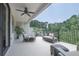 Relaxing outdoor balcony with outdoor seating and wooded views at 5836 Sandy Springs Cir, Atlanta, GA 30328
