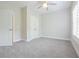 Bright bedroom with a ceiling fan, carpet, closet doors, and blinds at 5836 Sandy Springs Cir, Atlanta, GA 30328