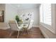 Cozy dining nook with a round table, four chairs, and a sunlit window at 5836 Sandy Springs Cir, Atlanta, GA 30328