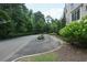 Private driveway leading to the property entrance surrounded by lush landscaping at 5836 Sandy Springs Cir, Atlanta, GA 30328