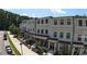 Attractive townhome exteriors with brick accents, black window frames and covered entryways at 5836 Sandy Springs Cir, Atlanta, GA 30328