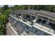 An eye-level exterior view shows multiple covered balconies on this new townhouse with a wooded backdrop at 5836 Sandy Springs Cir, Atlanta, GA 30328