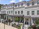 Charming townhomes featuring brick facade, covered entryways and manicured landscaping enhancing curb appeal at 5836 Sandy Springs Cir, Atlanta, GA 30328