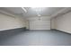 This spacious two-car garage has freshly painted floors and is ready for your vehicles and storage at 5836 Sandy Springs Cir, Atlanta, GA 30328