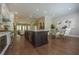 Open-concept kitchen with a large island, stainless steel appliances, and adjacent dining area at 5836 Sandy Springs Cir, Atlanta, GA 30328