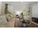 Spacious living room with hardwood floors, an open layout, modern lighting, and stylish decor at 5836 Sandy Springs Cir, Atlanta, GA 30328