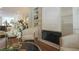 Stylish living room featuring a modern fireplace, built-in shelving, and hardwood floors at 5836 Sandy Springs Cir, Atlanta, GA 30328