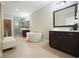 Luxurious main bathroom with double vanities, a soaking tub, and a glass-enclosed shower at 5836 Sandy Springs Cir, Atlanta, GA 30328