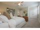 Well-lit main bedroom with neutral paint, carpeted floors, a ceiling fan and a cozy design at 5836 Sandy Springs Cir, Atlanta, GA 30328