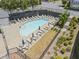 Aerial view of a community pool offering lounge chairs and umbrellas, set in a landscaped environment at 5836 Sandy Springs Cir, Atlanta, GA 30328
