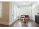 Bright sunroom with comfortable seating and views of the surrounding landscape at 5836 Sandy Springs Cir, Atlanta, GA 30328