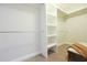 Walk-in closet with built-in shelving and ample storage space at 5836 Sandy Springs Cir, Atlanta, GA 30328
