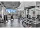Bright gym with a full complement of free weights and modern machines, complemented by a scenic city view at 860 Peachtree Ne St # 1912, Atlanta, GA 30308